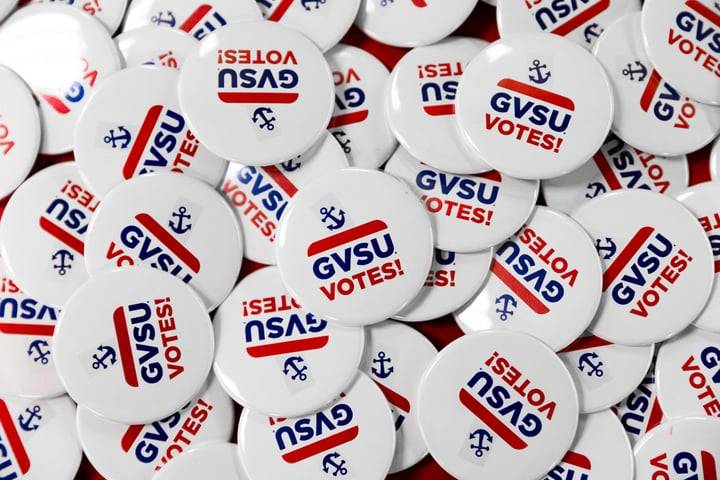 White GVSU Votes Buttons on a table